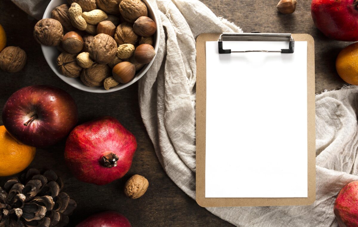 top-view-notepad-with-autumn-fruits-nuts
